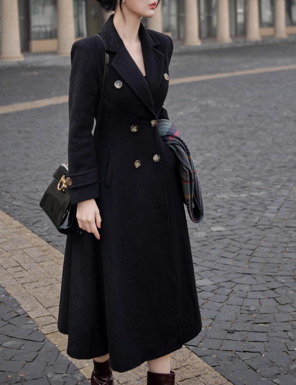 A women’s long wool-blend winter coat with a double-breasted front, notch lapel collar, and side pockets, designed to keep you warm and stylish through fall and winter. It has a knee-length silhouette that works for casual and dressier outfits alike.